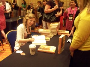 Author Lauren Willig signs at an autographing session.